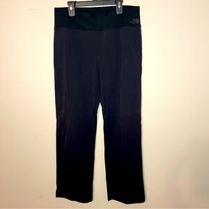 Women’s The North Face black athletic pants size medium with zippered pockets